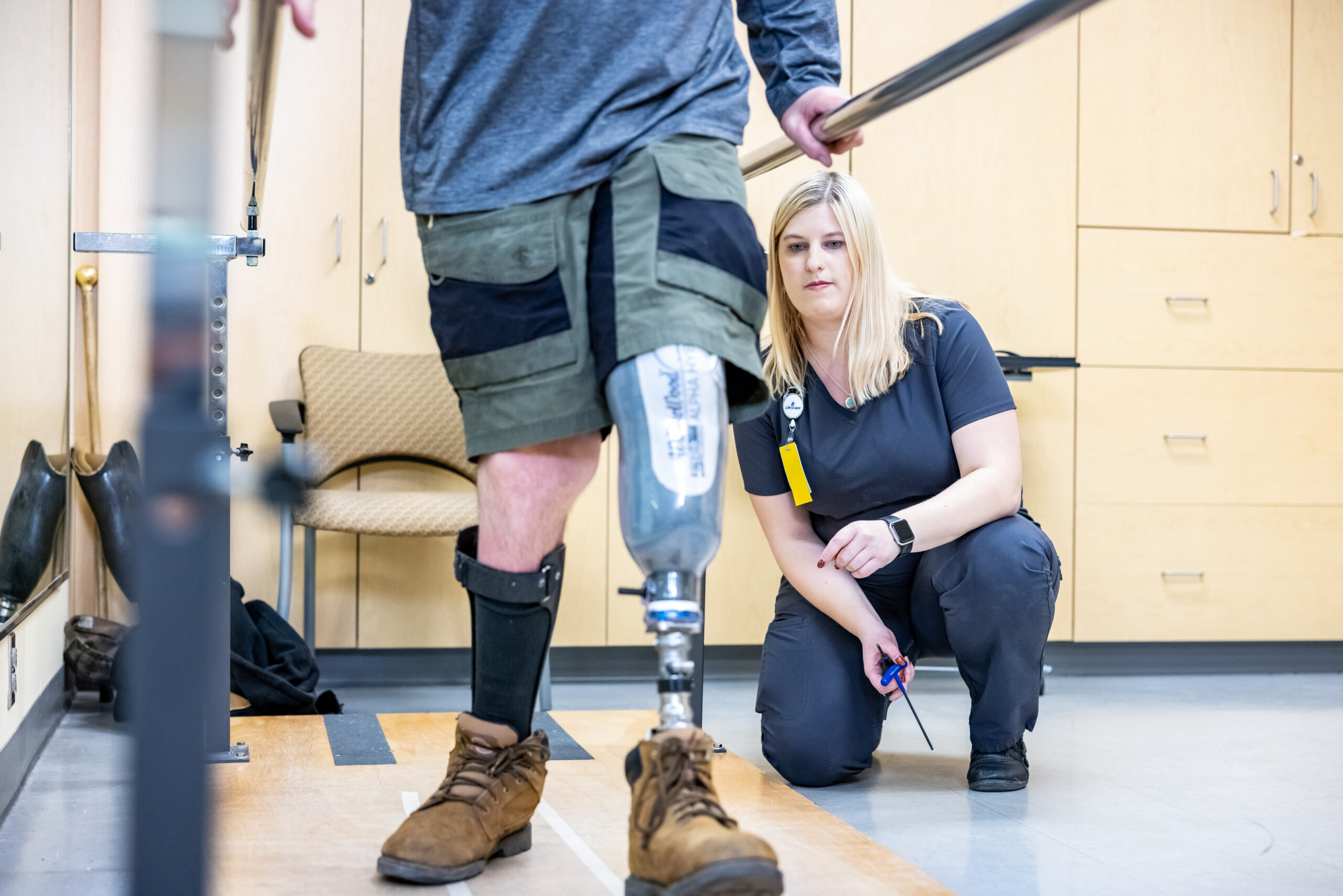 Woman and man with a metal leg