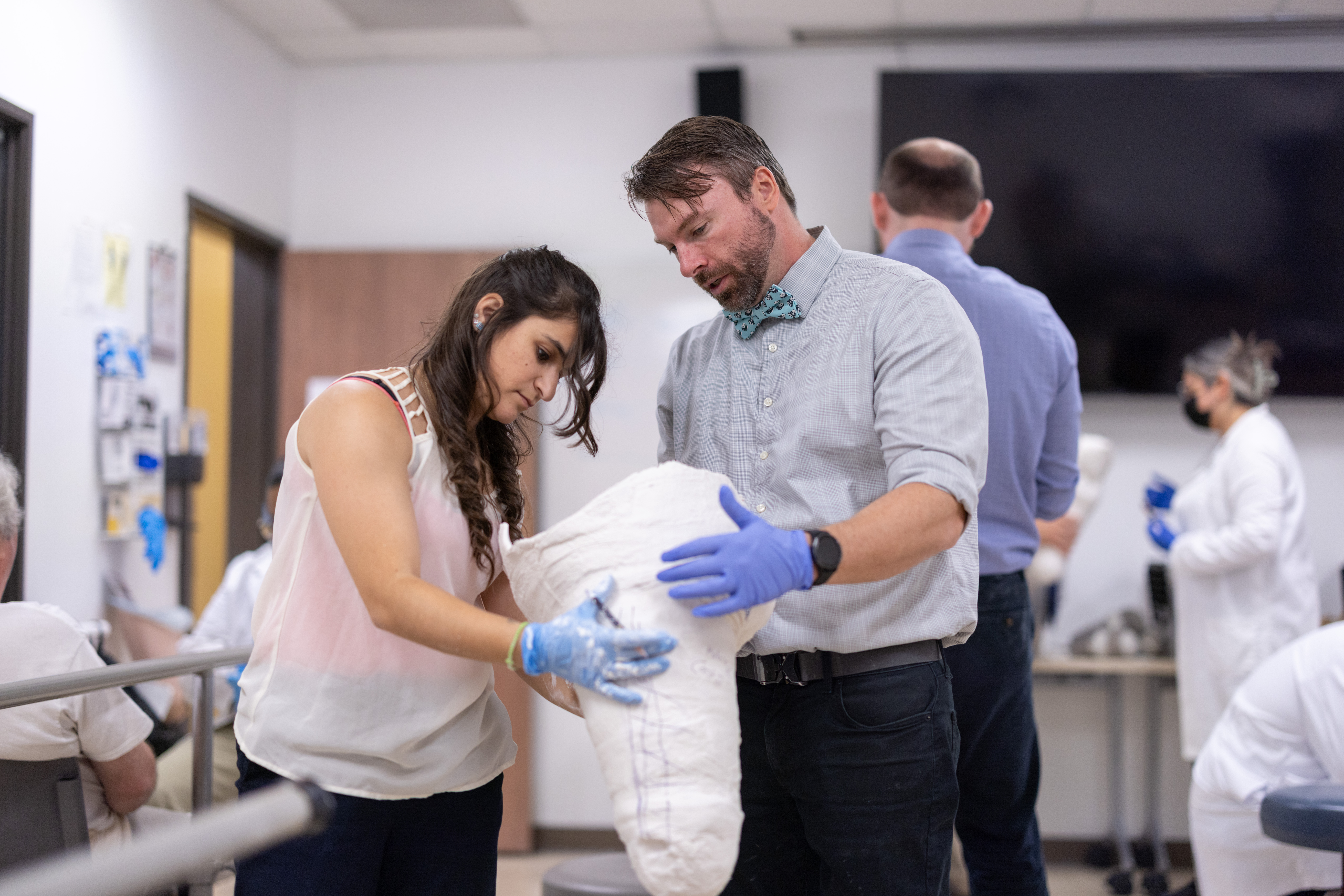 man and woman holding cast